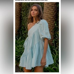 Showpo HARLEEN MINI DRESS - ASYMMETRICAL TRIM PUFF SLEEVE DRESS IN LIGHT BLUE